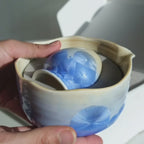 Snow Blue Matcha Set – 5 Piece Japanese Tea Ceremony Kit video showing unboxing of ceramic bowl, metal strainer, bamboo whisk and spoon. 